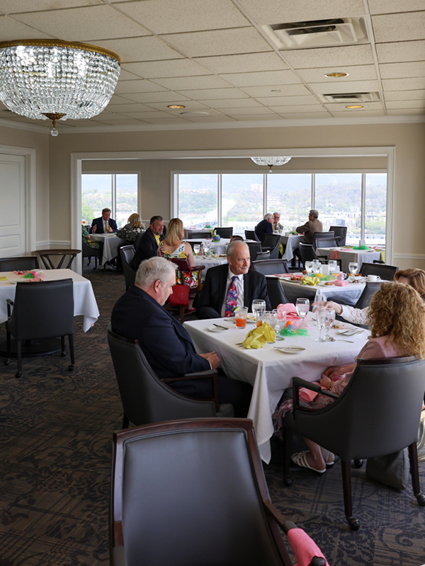 Walden Club Members and guests enjoying brunch in the Riverview Room with views looking North toward the Tennessee River.